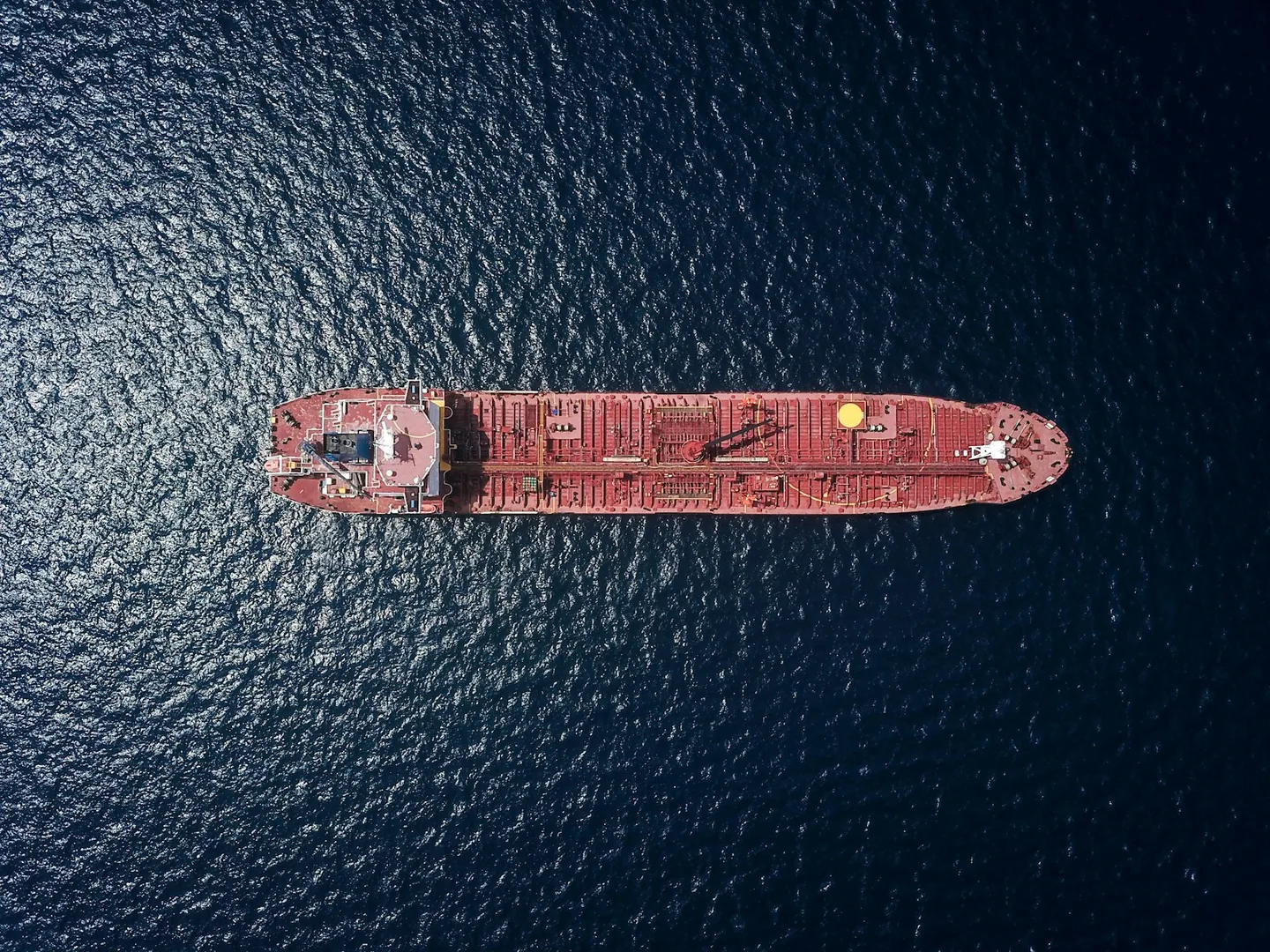 Aerial view of a red tanker underway at sea